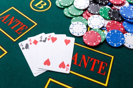 Poker chips on a poker table at the casino. Closeup. quads, a winning combination. Chips winnerの写真素材