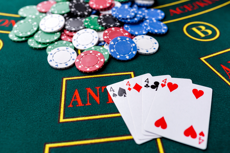 Poker chips on a poker table at the casino. Closeup. quads, a winning combination. Chips winnerの写真素材