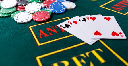 Poker chips on a poker table at the casino. Closeup. quads, a winning combination. Chips winnerの写真素材