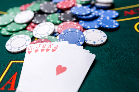 Poker chips on a poker table at the casino. Closeup. royal flush, winning combination. Chips winnerの写真素材