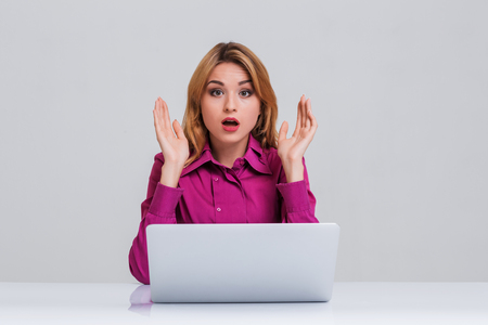 Young businesswoman working at laptop computer. she was surprised, printsの写真素材