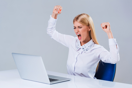 Young businesswoman working at laptop computer. she is happy pleasedの写真素材