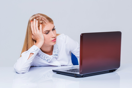 Young businesswoman working at laptop computer. tired girl soon fell asleep stressの写真素材