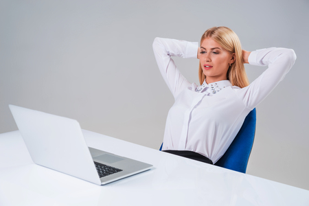 Young businesswoman working at laptop computer. she pleased, to do the work is happyの写真素材