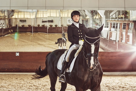 woman jockey with his horse in uniform for Dressageの写真素材