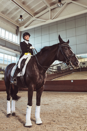 woman jockey with his horse in uniform for Dressageの写真素材