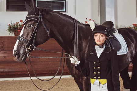 woman jockey with his horse in uniform for Dressageの写真素材
