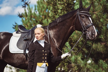 woman jockey with his horse in uniform for Dressageの写真素材