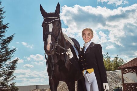 woman jockey with his horse in uniform for Dressageの写真素材