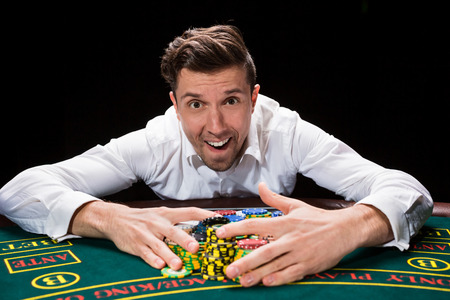 happy player online poker takes win chips. smiling fool funの写真素材