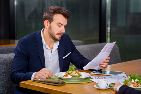 A woman and a man on a business lunch in a restaurant. meet the project and dataの写真素材