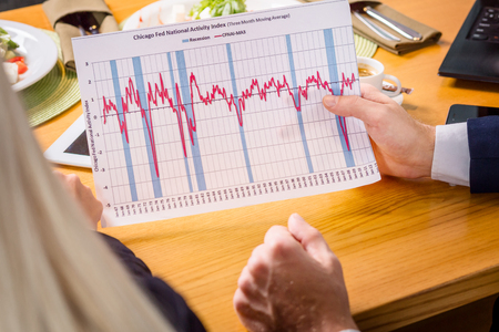 A woman and a man on a business lunch in a restaurant. meet the project and dataの写真素材