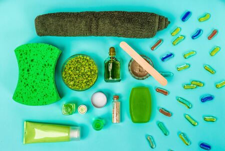 Spa set: soap, mask, oil, sea salt and towel on blue backgroundの写真素材