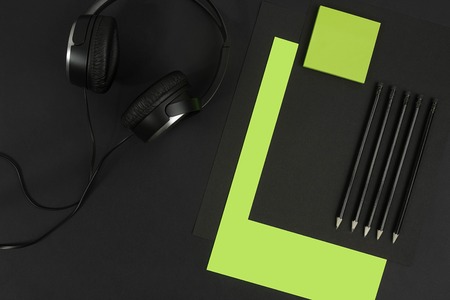 Top view of office supplies on blackboard background with copy space.の写真素材