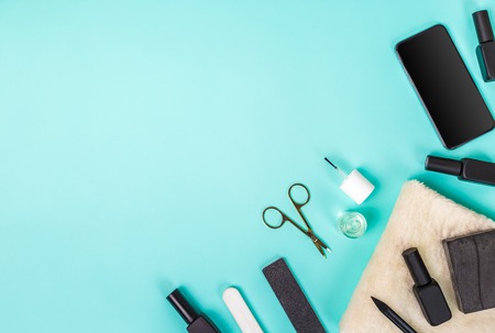 Top view of manicure and pedicure equipment on blue background. Still life. Copy spaceの写真素材
