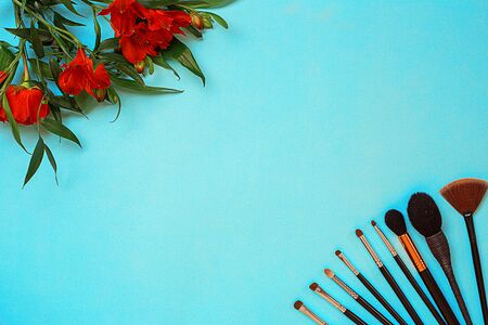 Various brushes on blue background. Top view. Still life. Copy spaceの写真素材