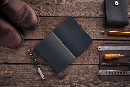 Leather products. Work place craftsman in a workshop. Top viewの写真素材