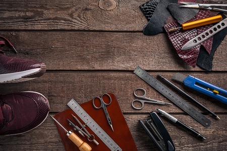 Leather products. Work place craftsman in a workshop. Top viewの写真素材