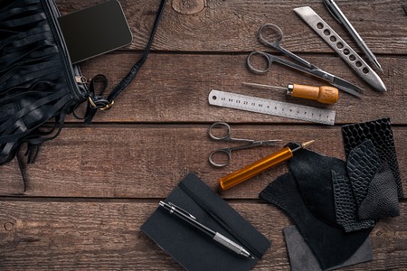 Leather products. Work place craftsman in a workshop. Place for your text or logo. Ideal for blog. Top viewの写真素材