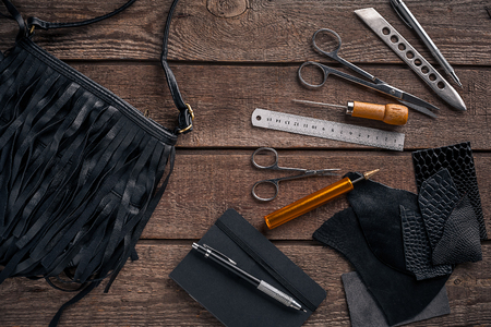 Leather products. Work place craftsman in a workshop. Place for your text or logo. Ideal for blog. Top viewの写真素材