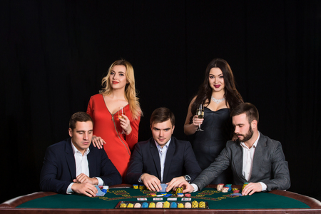 People at the poker table in casinoの写真素材