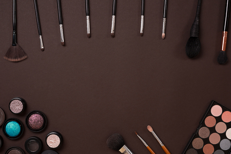 brush for makeup, eye shadow, view from above. Still life. On a brown background. Copy spaceの写真素材