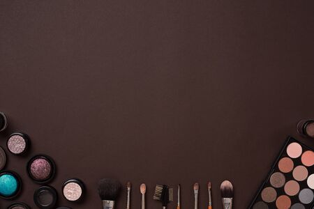 brush for makeup, eye shadow, view from above. Still life. On a brown background. Copy spaceの写真素材