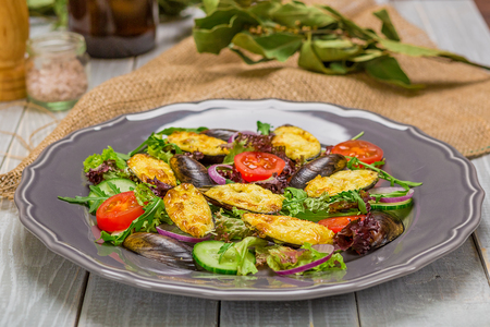 Fresh vegetable salad, healthy food, organic cucumbers,
mussels, tomatoes and salad leavesの写真素材