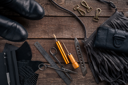 Leather crafting. Tools flat lay still life. Top view. Copy spaceの写真素材