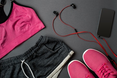 Workout plan with fitness food and sport equipment on gray background, top view. Copy space. Still lifeの写真素材