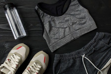 Workout plan with fitness food and sport equipment on dark background, top view. Copy space. Still lifeの写真素材