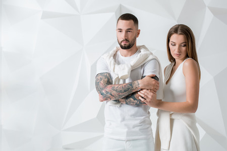 Young couple in casual clothing on white backgroundの写真素材