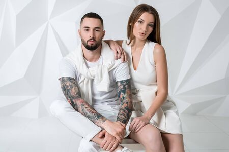 Fashionable couple posing at studio.の写真素材