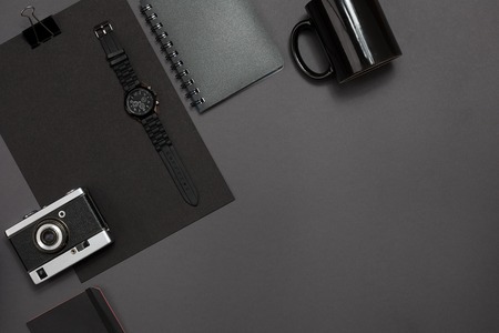 Black objects from the office on a dark gray background. Work and creativity. Top view.の写真素材