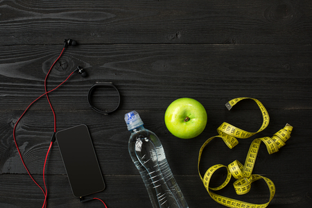 Athletes set with bottle of water on dark backgroundの写真素材