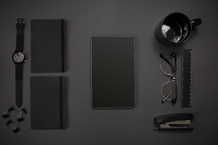 Black objects from the office on a dark gray background. Work anの写真素材