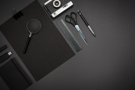 Black objects from the office on a dark gray background. Work anの写真素材