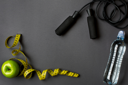 Athletes set with bottle of water on dark gray backgroundの写真素材