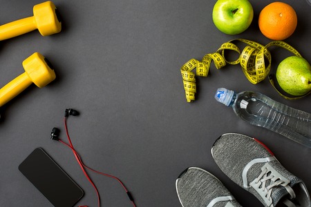 Sports accessories for fitness on the dark floor. Healthy lifestyle concept.の写真素材