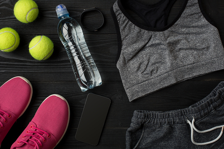 Sports accessories for fitness on the wooden floor. Healthy lifestyle concept.の写真素材