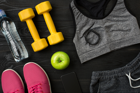 Sports accessories for fitness on the wooden floor. Healthy lifestyle concept.の写真素材