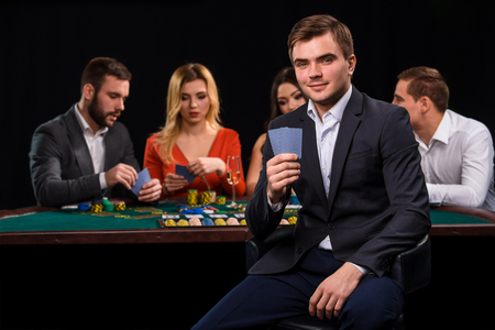 Young people playing poker at the table. Casinoの写真素材
