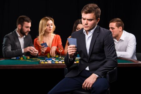 Young people playing poker at the table. Casinoの写真素材