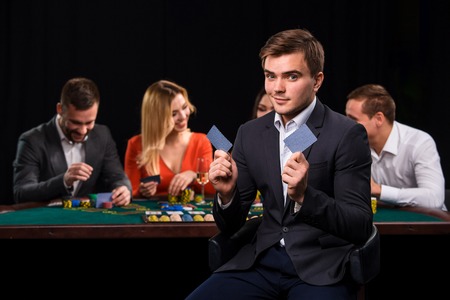 Young people playing poker at the table. Casinoの写真素材