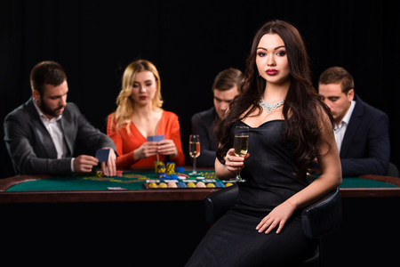 Young people playing poker at the table. Casinoの写真素材