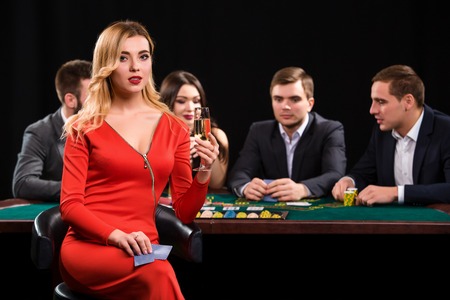 Young people playing poker at the table. Casinoの写真素材