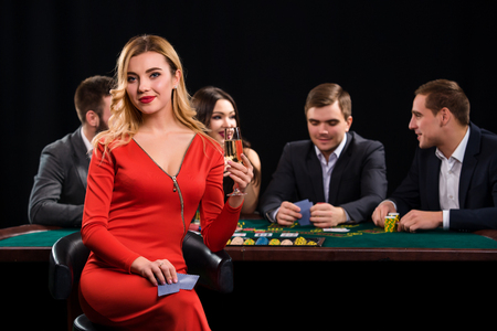 Young people playing poker at the table. Casinoの写真素材