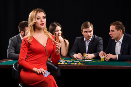 Young people playing poker at the table. Casinoの写真素材