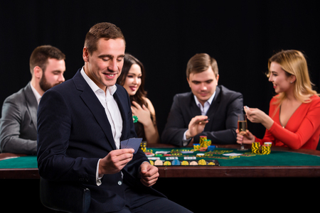 Young people playing poker at the table. Casinoの写真素材