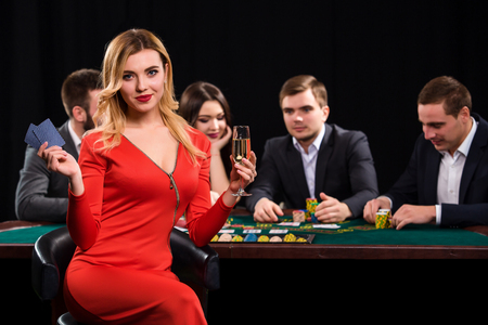 Young people playing poker at the table. Casinoの写真素材